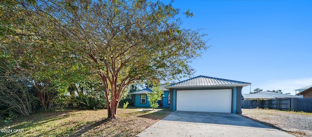 single story home featuring a garage