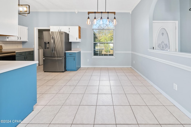 kitchen with hanging light fixtures, white cabinetry, appliances with stainless steel finishes, and ornamental molding