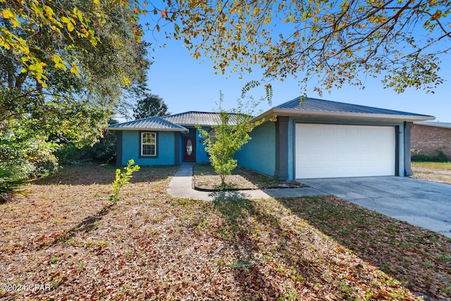 ranch-style home featuring a garage