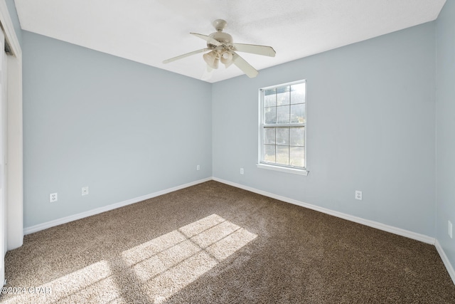 unfurnished room featuring carpet flooring and ceiling fan