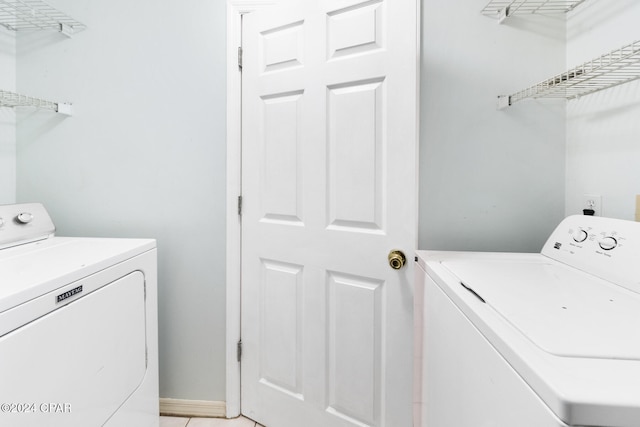 clothes washing area featuring washing machine and dryer