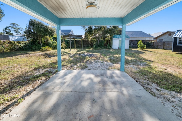 view of patio / terrace featuring a shed