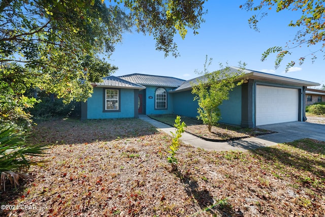 single story home featuring a garage