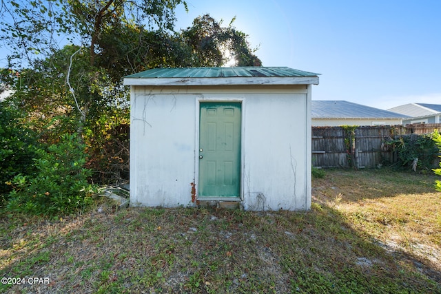 view of outbuilding featuring a yard