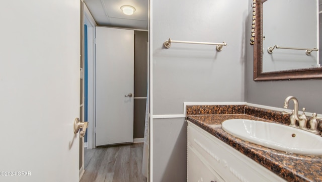 bathroom featuring vanity and hardwood / wood-style flooring