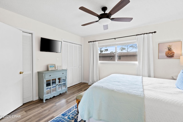 bedroom with ceiling fan and light hardwood / wood-style floors