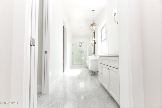 hall featuring marble finish floor