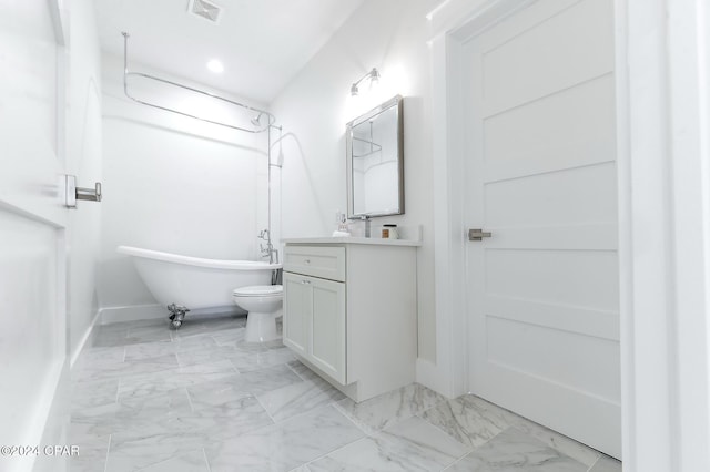 full bathroom with visible vents, marble finish floor, a soaking tub, and vanity