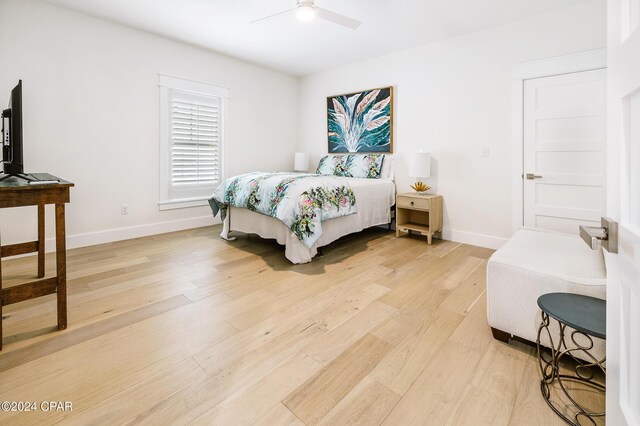 bedroom featuring hardwood / wood-style flooring and ceiling fan