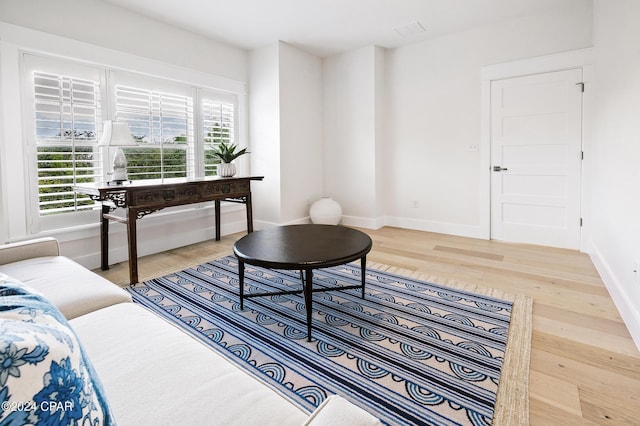 sitting room featuring wood finished floors and baseboards