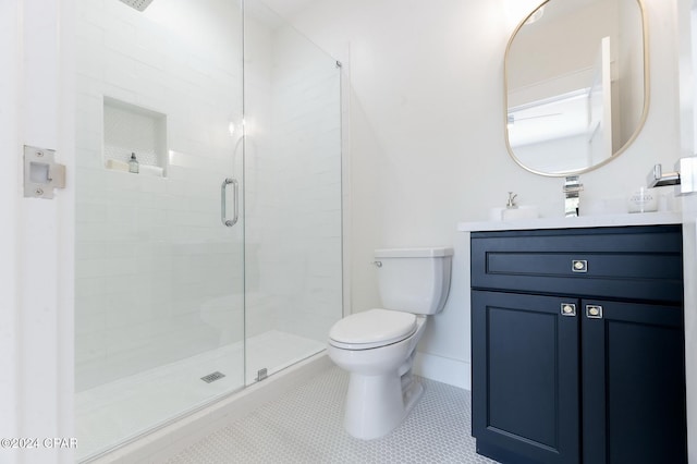 full bath with toilet, tile patterned floors, a shower stall, and vanity