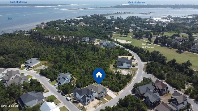 drone / aerial view featuring a water view and a residential view