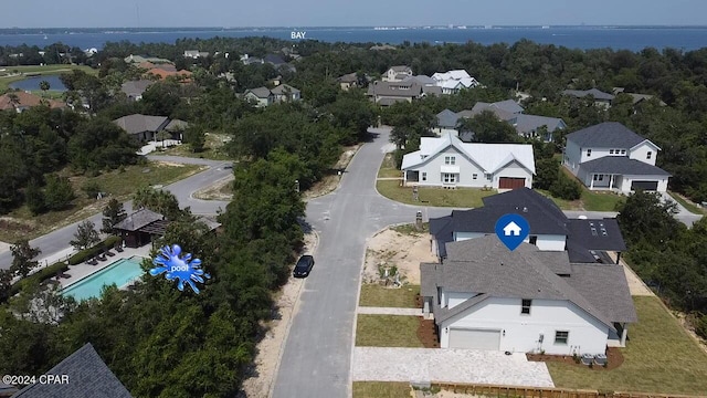 aerial view featuring a water view and a residential view