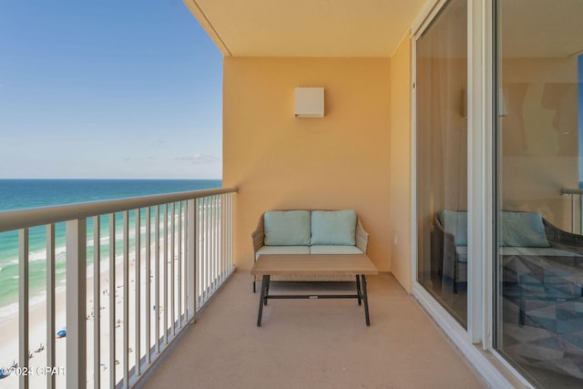 balcony with a view of the beach and a water view