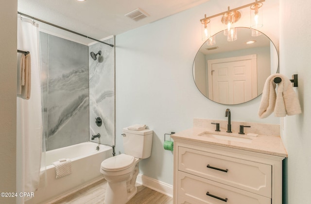 full bathroom with vanity, hardwood / wood-style floors, shower / bath combo with shower curtain, and toilet