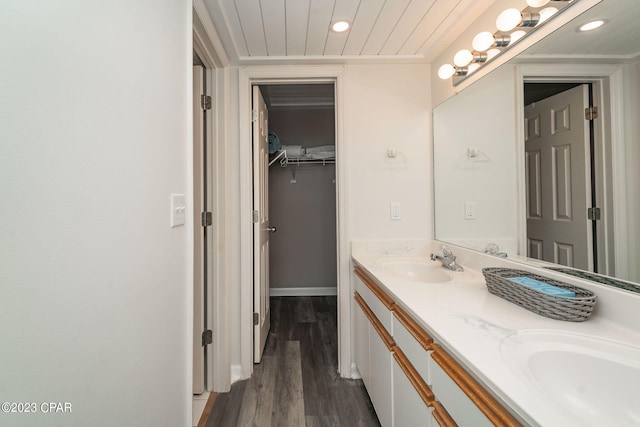 bathroom featuring vanity, hardwood / wood-style flooring, and wooden ceiling