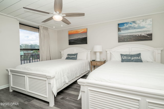 bedroom featuring dark hardwood / wood-style floors, ceiling fan, and wood ceiling