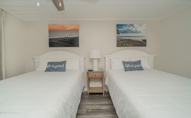 bedroom featuring dark hardwood / wood-style floors and ceiling fan