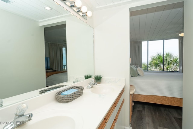 bathroom with vanity and hardwood / wood-style flooring