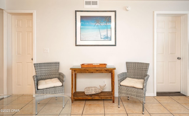 sitting room featuring light tile patterned floors