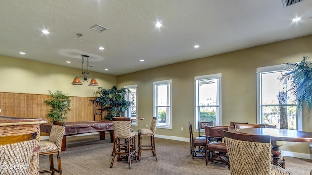 dining room featuring light colored carpet