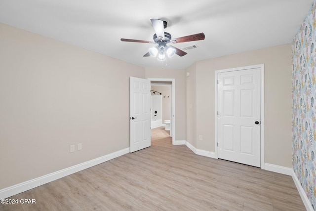 unfurnished bedroom featuring light hardwood / wood-style floors and ceiling fan