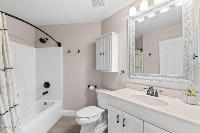 full bathroom featuring toilet, hardwood / wood-style floors, shower / bath combination with curtain, and vanity