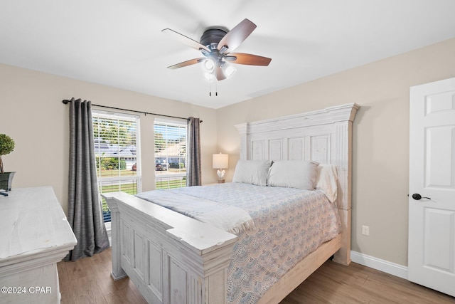 bedroom with light wood-type flooring and ceiling fan