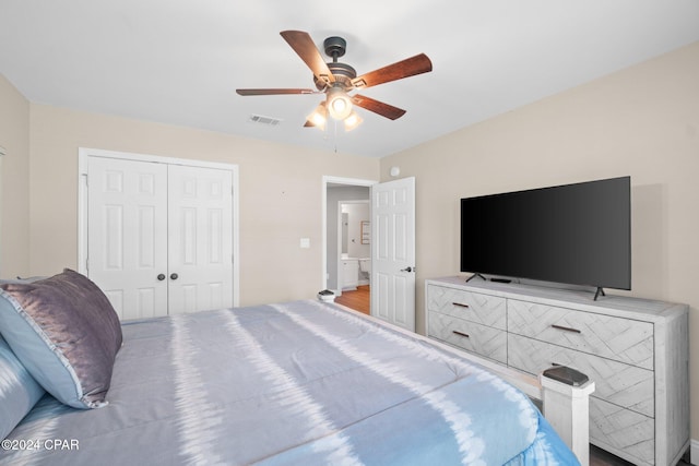 bedroom with wood-type flooring, a closet, and ceiling fan