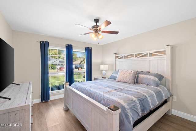 bedroom featuring hardwood / wood-style floors and ceiling fan