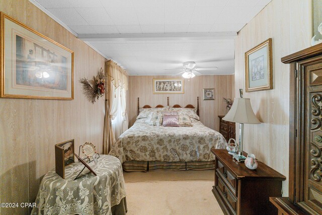 living area with wood walls and carpet floors