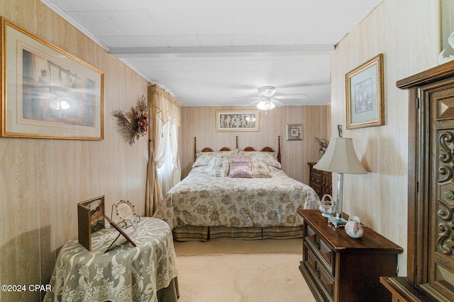 bedroom featuring light colored carpet and ceiling fan