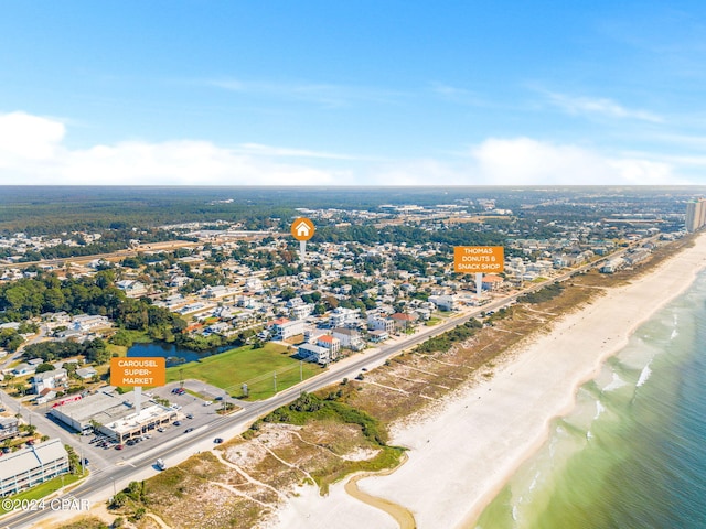 birds eye view of property featuring a view of the beach and a water view