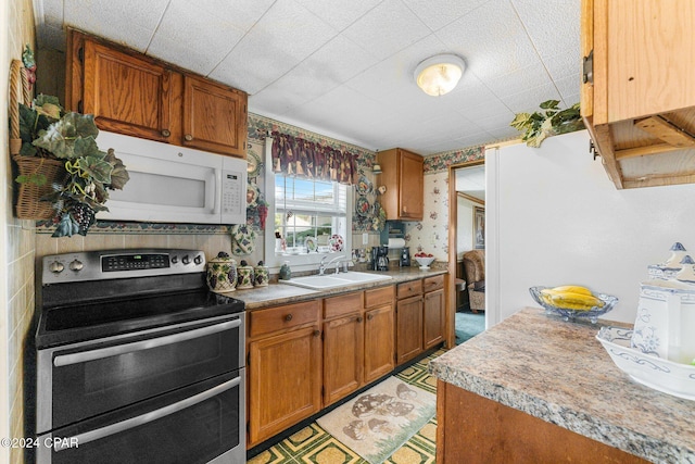 kitchen with double oven range and sink