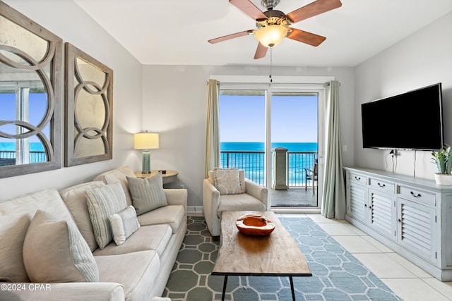 living room featuring light tile patterned floors and ceiling fan