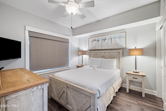 bedroom featuring ceiling fan and dark hardwood / wood-style floors