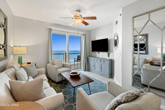 living room with tile patterned flooring and ceiling fan