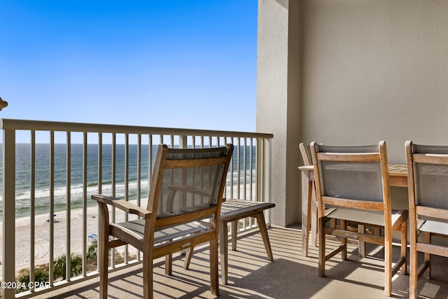 balcony with a beach view and a water view