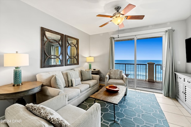 living room featuring ceiling fan and light tile patterned floors