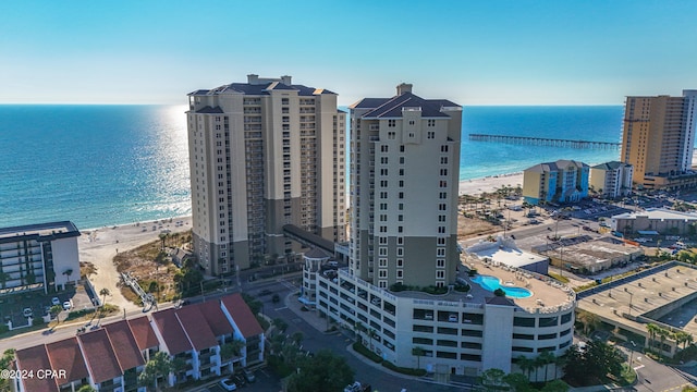 bird's eye view featuring a water view and a view of the beach