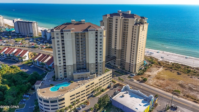 aerial view featuring a water view and a beach view