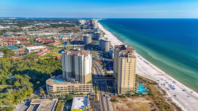 drone / aerial view with a water view and a beach view