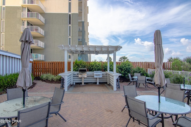 view of patio / terrace with a balcony and a pergola