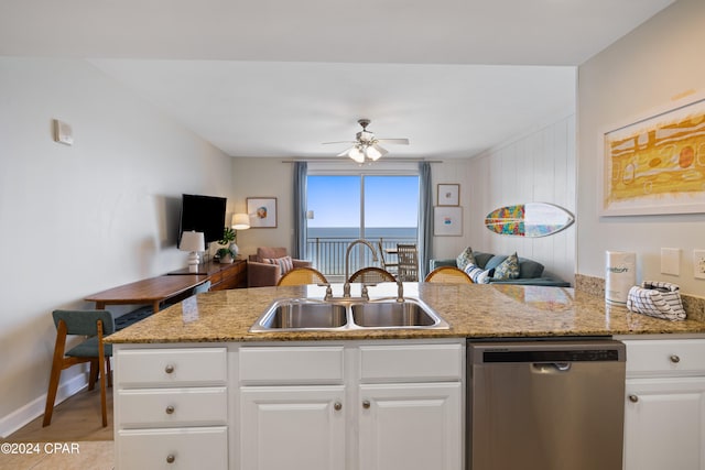 kitchen with stainless steel dishwasher, ceiling fan, white cabinets, and sink