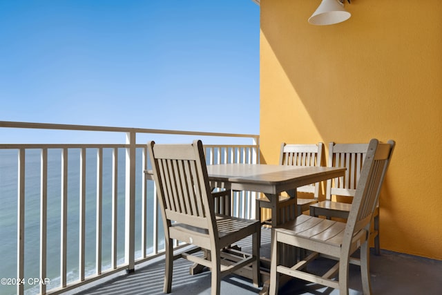 balcony featuring a water view