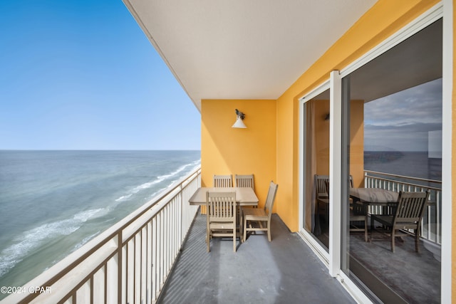 balcony with a view of the beach and a water view