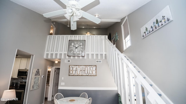 stairs with ceiling fan