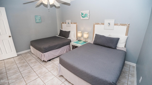 bedroom featuring light tile patterned floors and ceiling fan