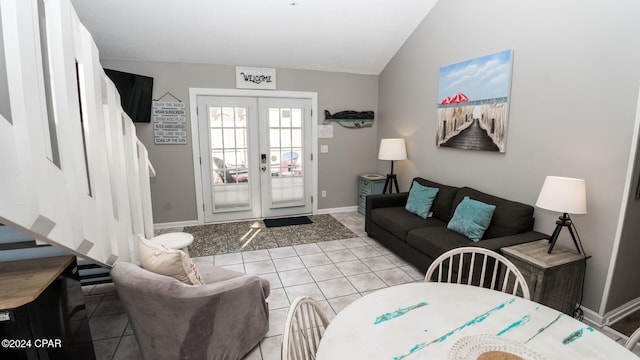 living room with french doors, vaulted ceiling, and light tile patterned floors