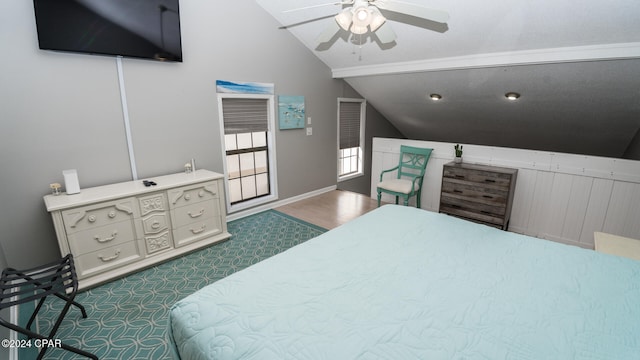 bedroom featuring dark wood-type flooring, ceiling fan, and lofted ceiling